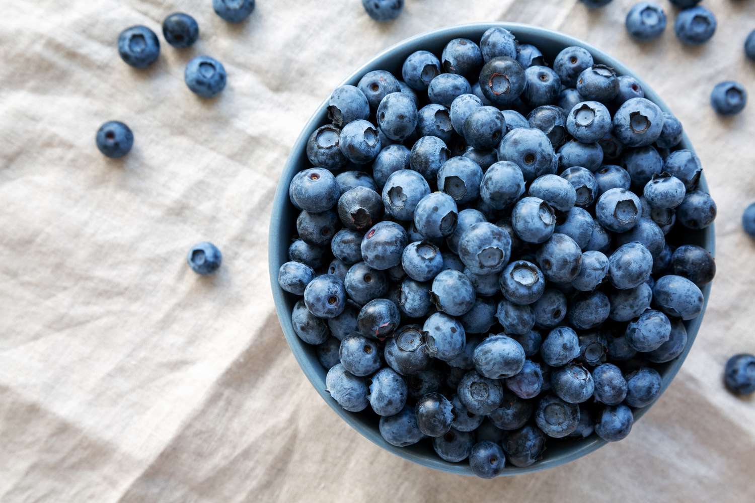 raw-organic-blueberries-in-a-bowl--top-view--flat-lay--overhead--from-above--1947472183-bb654ebf5a74456d860080219f4fc9f4.jpg